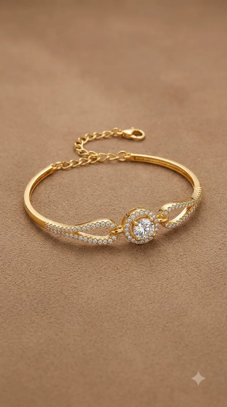 Gold-tone bracelet with a round solitaire stone in a halo and pavé-set loops