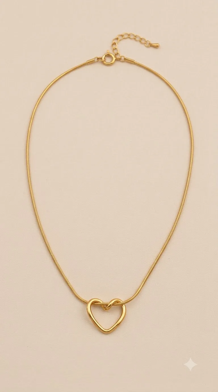 Gold-tone open heart pendant on a fine snake chain necklace