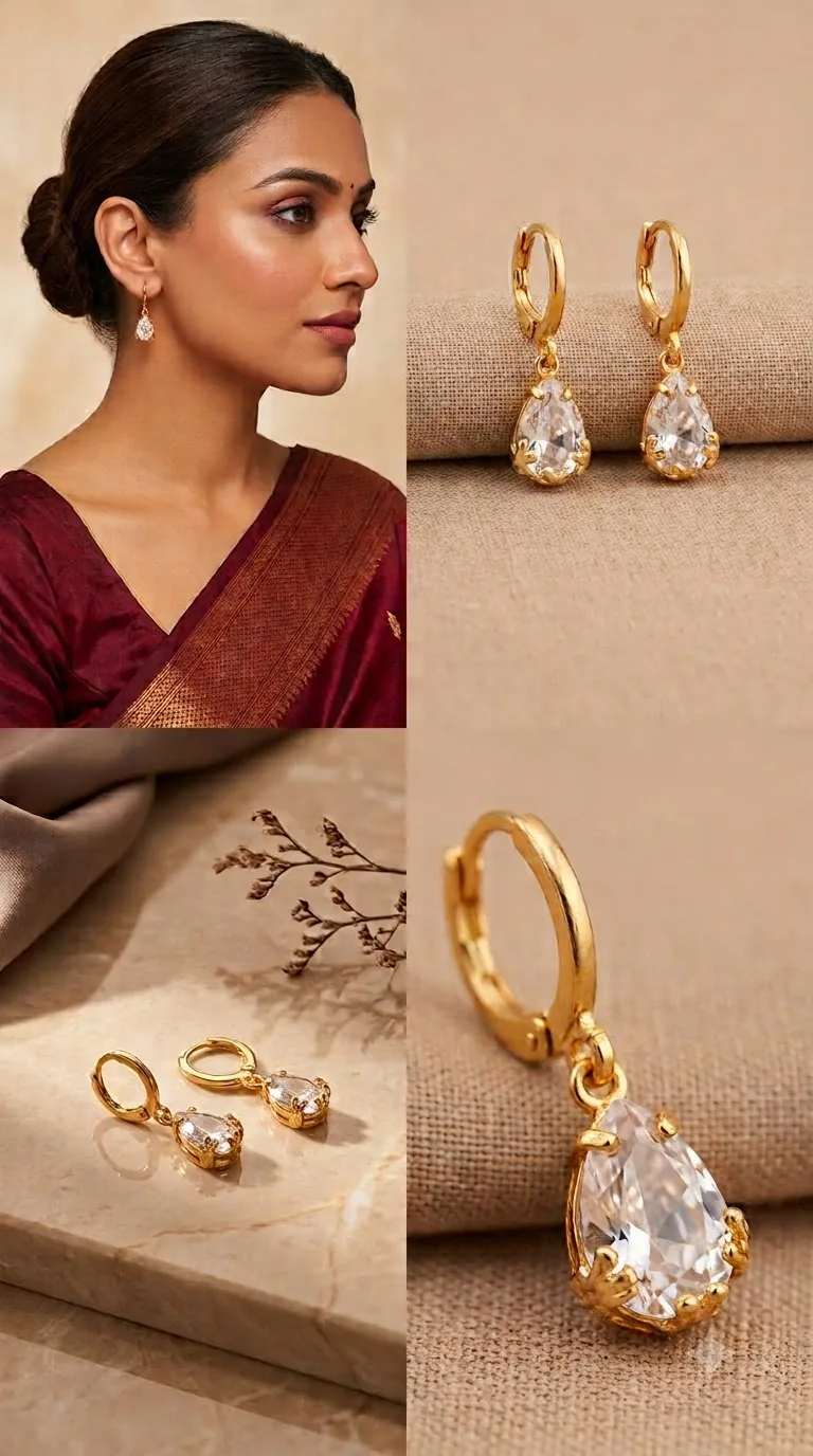 Gold-tone huggie hoop earrings with clear teardrop crystals